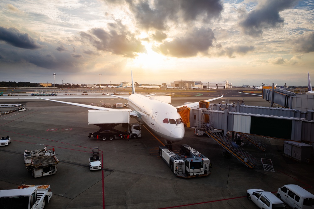 Airplane near the terminal in an airport at the sunset, Narita international airport