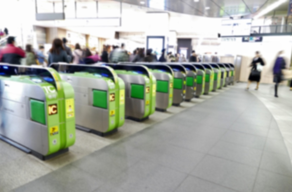 blurred electronic gates at train station using IC card in Shinjuku, Tokyo, Japan