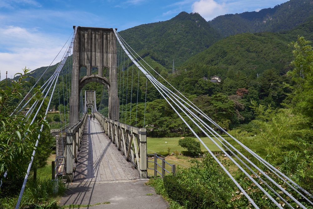 Historical wooden Momosuke suspension bridge in Nagiso, on the Nakasendo Trail - Nagano Prefecture, Honshu, Japan