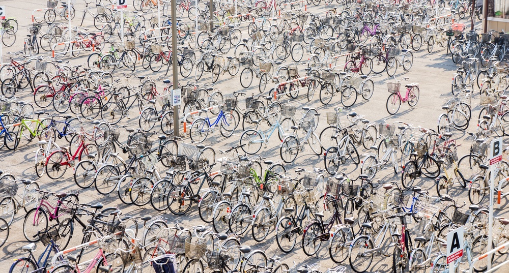 many of bicycles are parking near train station in Japan