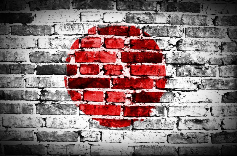 Japan flag painted on old brick wall