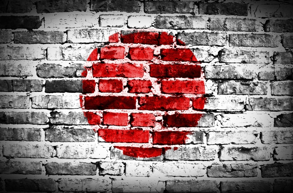 Japan flag painted on old brick wall