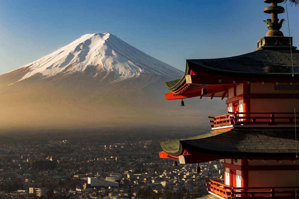 Chureito pagoda in foreground and mount fuji in background during sunrise time. Beautiful nature and human culture