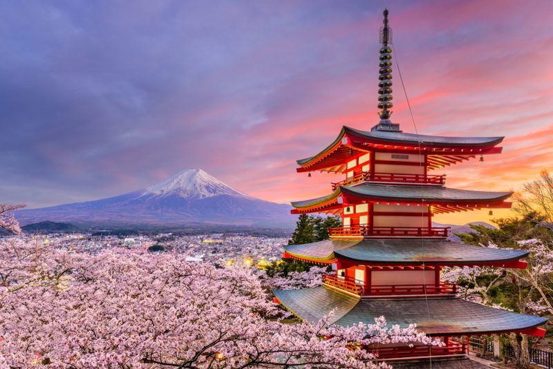 Fujiyoshida, Japan at Chureito Pagoda and Mt. Fuji in the spring with cherry blossoms