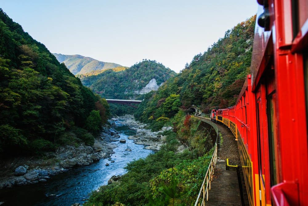 Romantic train in Osaka Japan scene from the river below